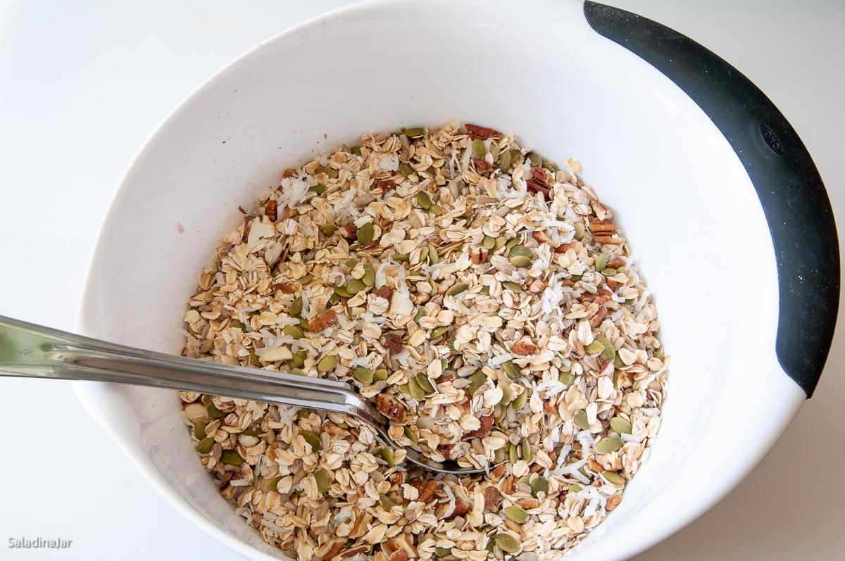 mixing granola in a bowl