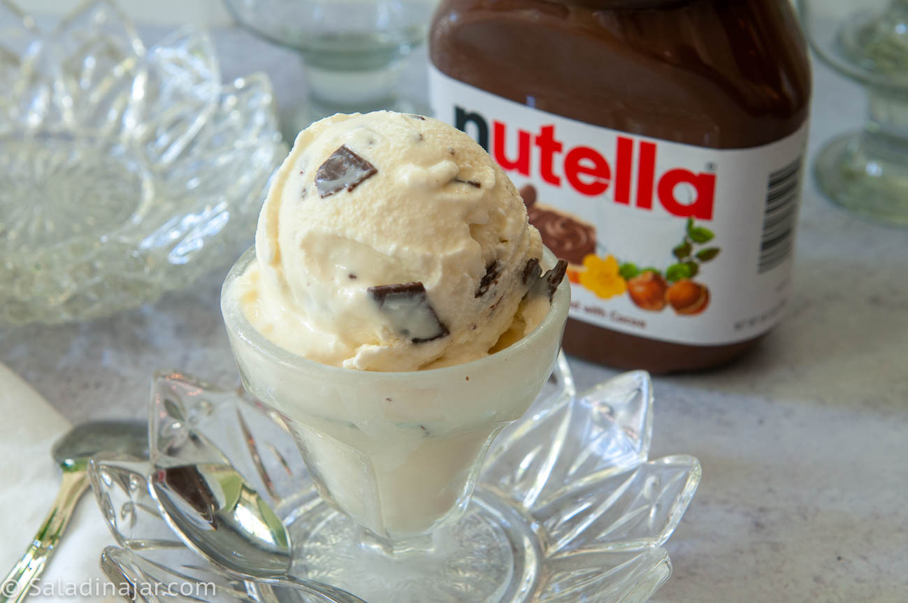 nutella ice cream sitting next to a jar of Nutella