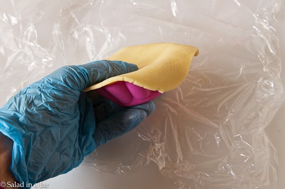 pressing the dough into a mold.