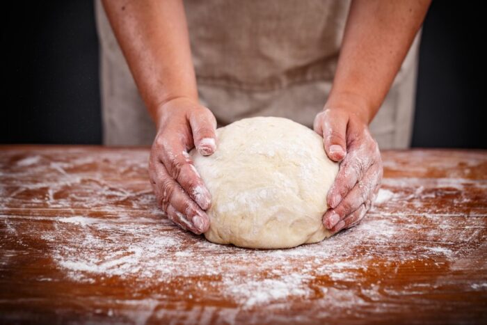 using a lot of flour with the dough. 