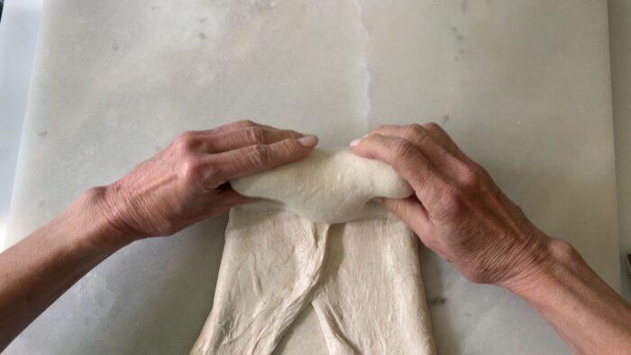 rolling up the dough towards your body.