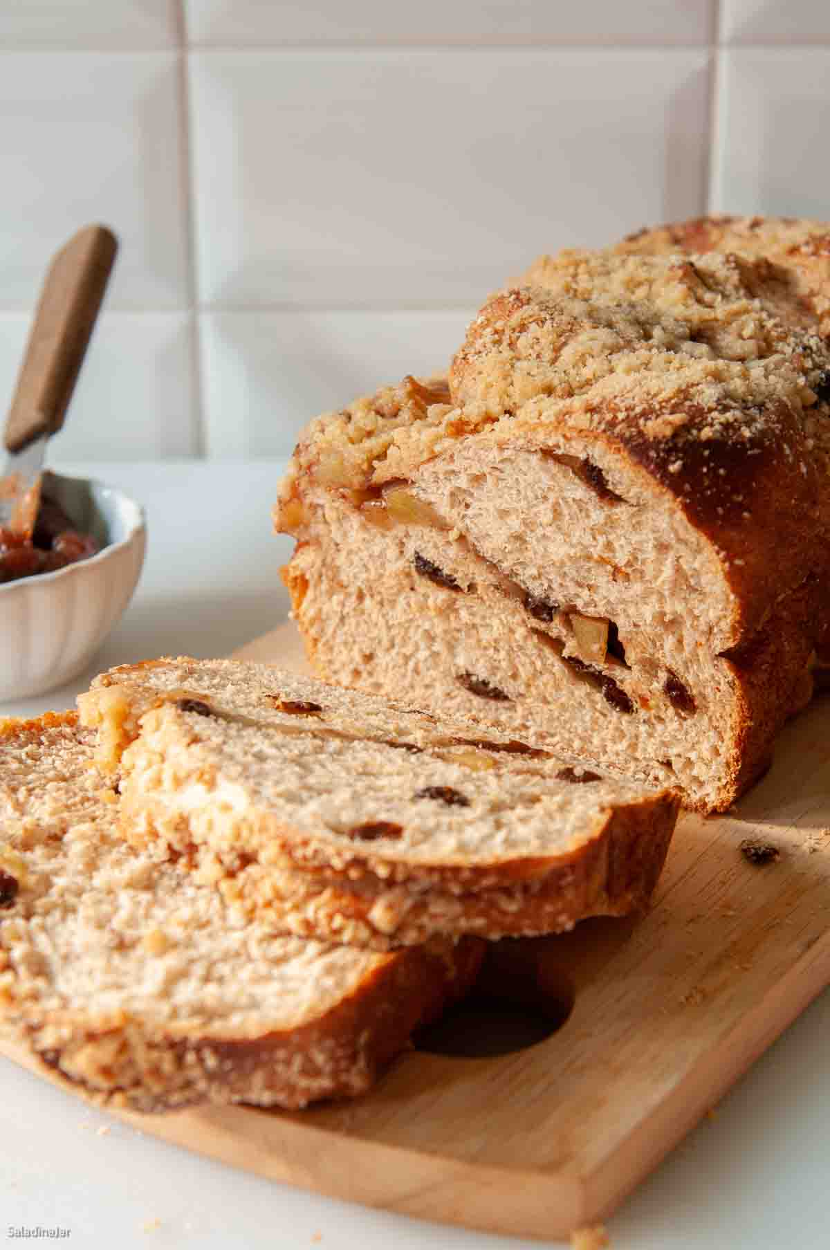 Apple Cinnamon Bread Machine Bread baked and sliced on a cutting board