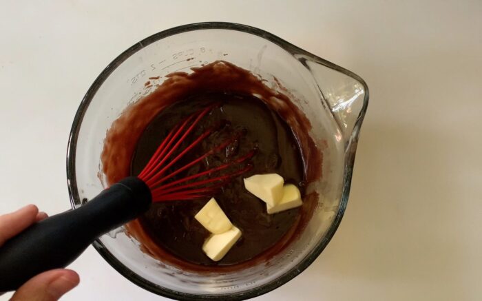 adding remaining ingredients to the chocolate pastry cream