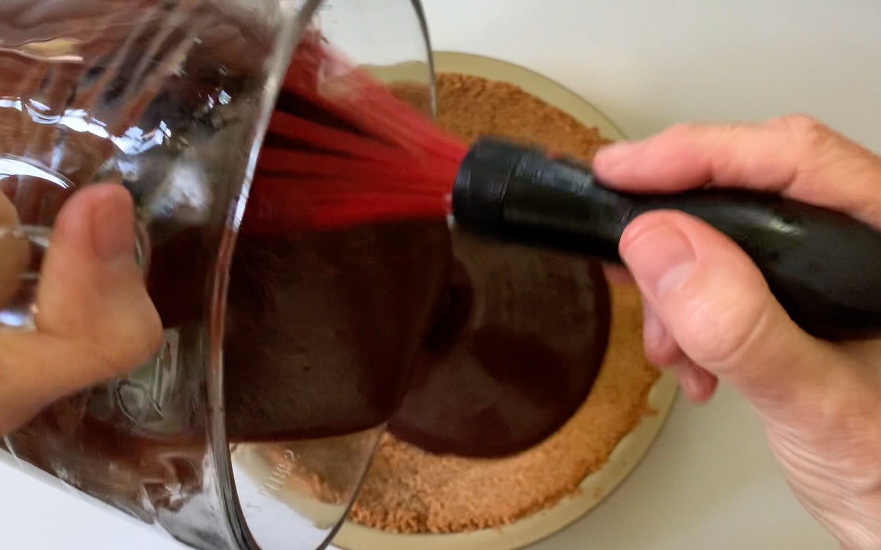 pouring the filling into the pie crust