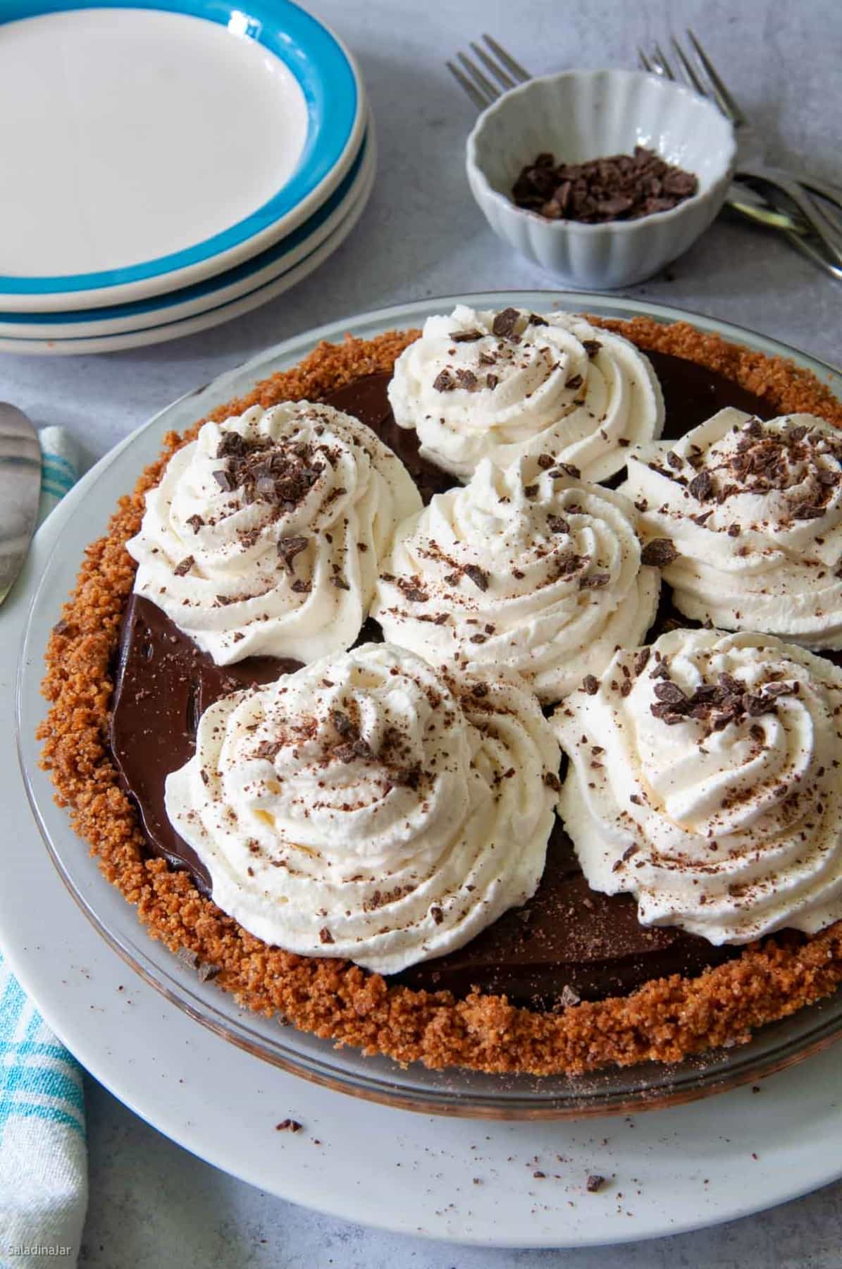 whole microwave chocolate pie with whipped cream and chocolate sprinkles on top