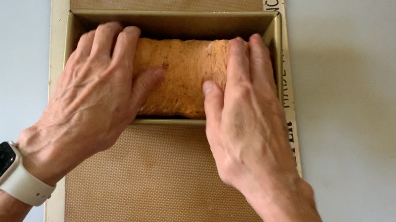 placing loaf into a bread pan