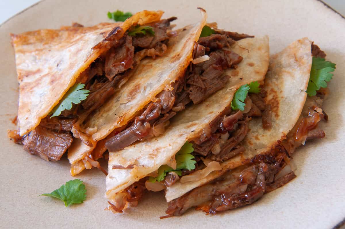 finished tortillas on a plate.