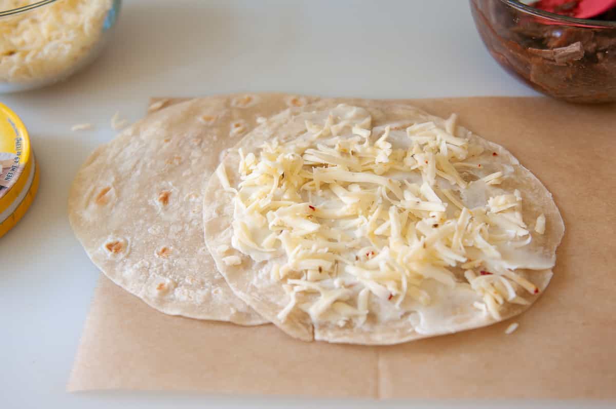tortilla sprinkled with cheese.