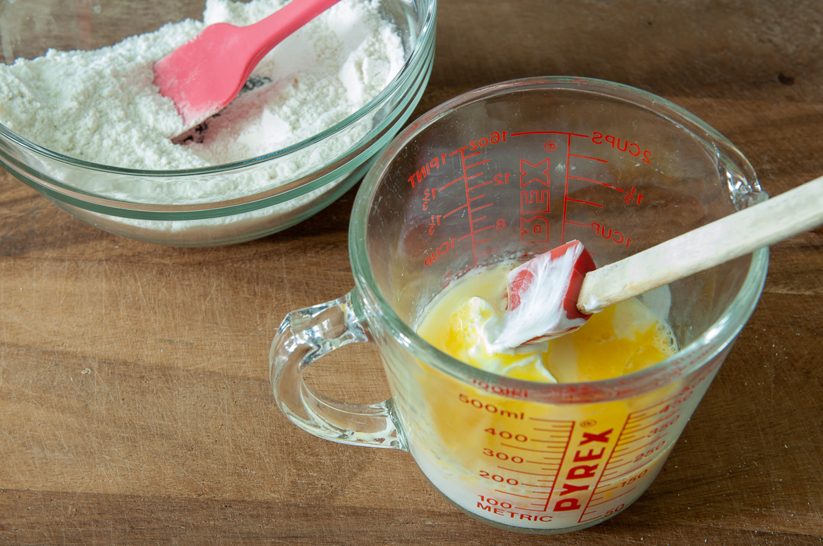 Stir together the liquids: milk, sour cream or buttermilk, egg and oil