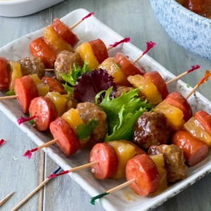 sausage kabobs arranges on a tray