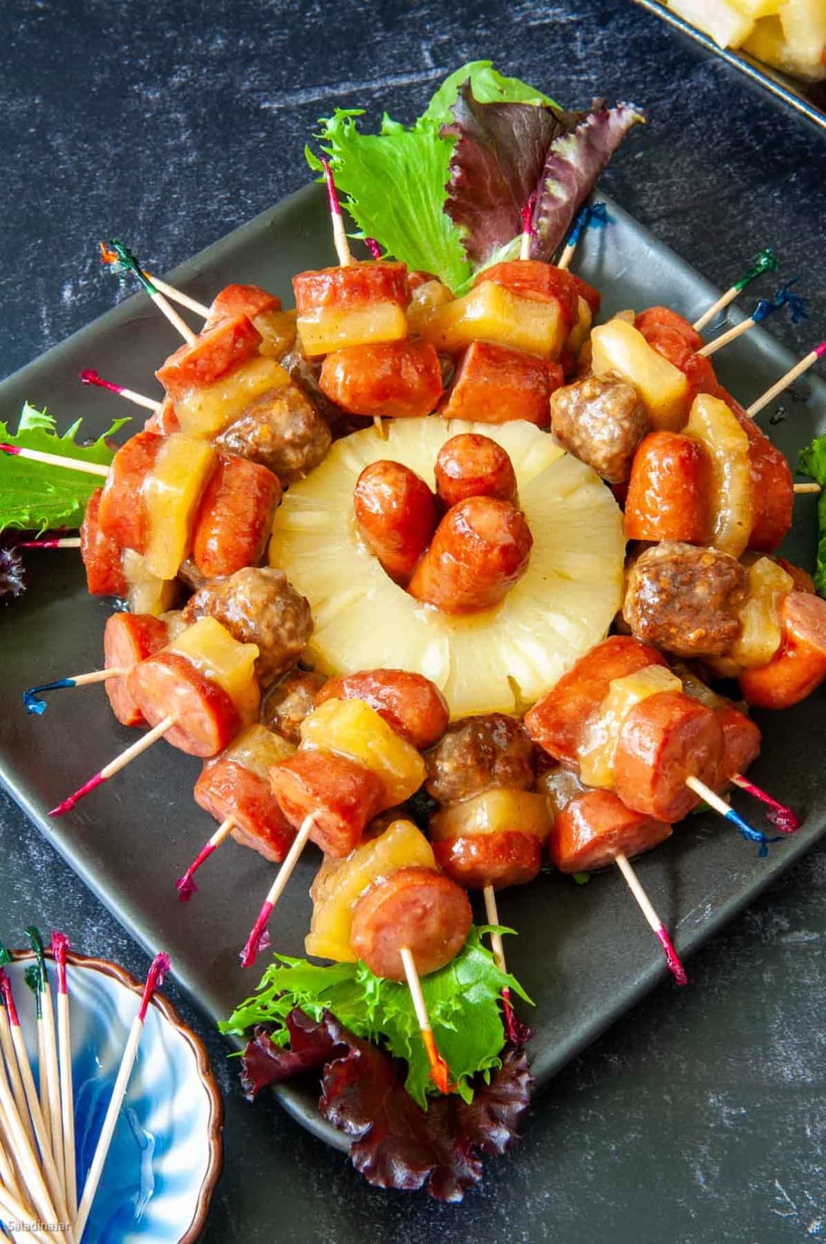 serving tray full of sausage kabobs