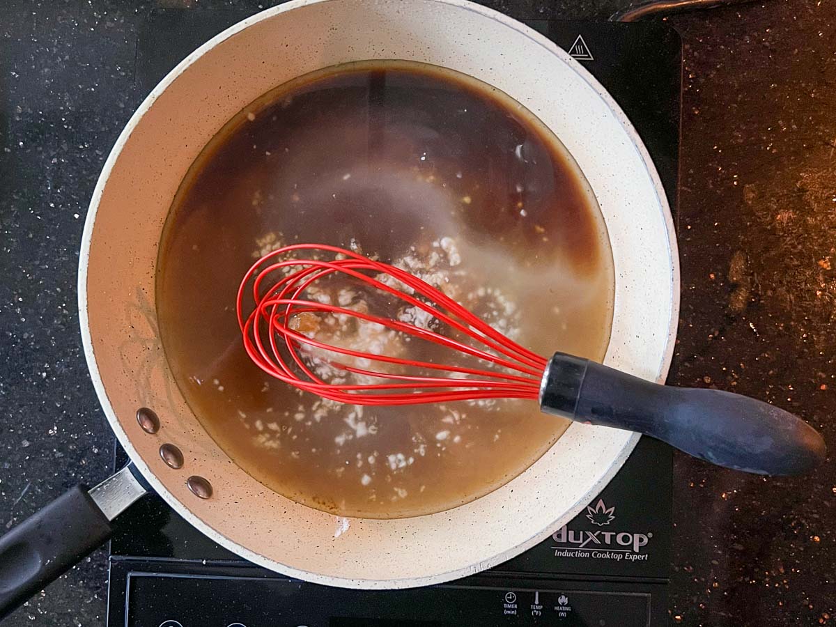 adding remaining ingredients to sauce in a skillet