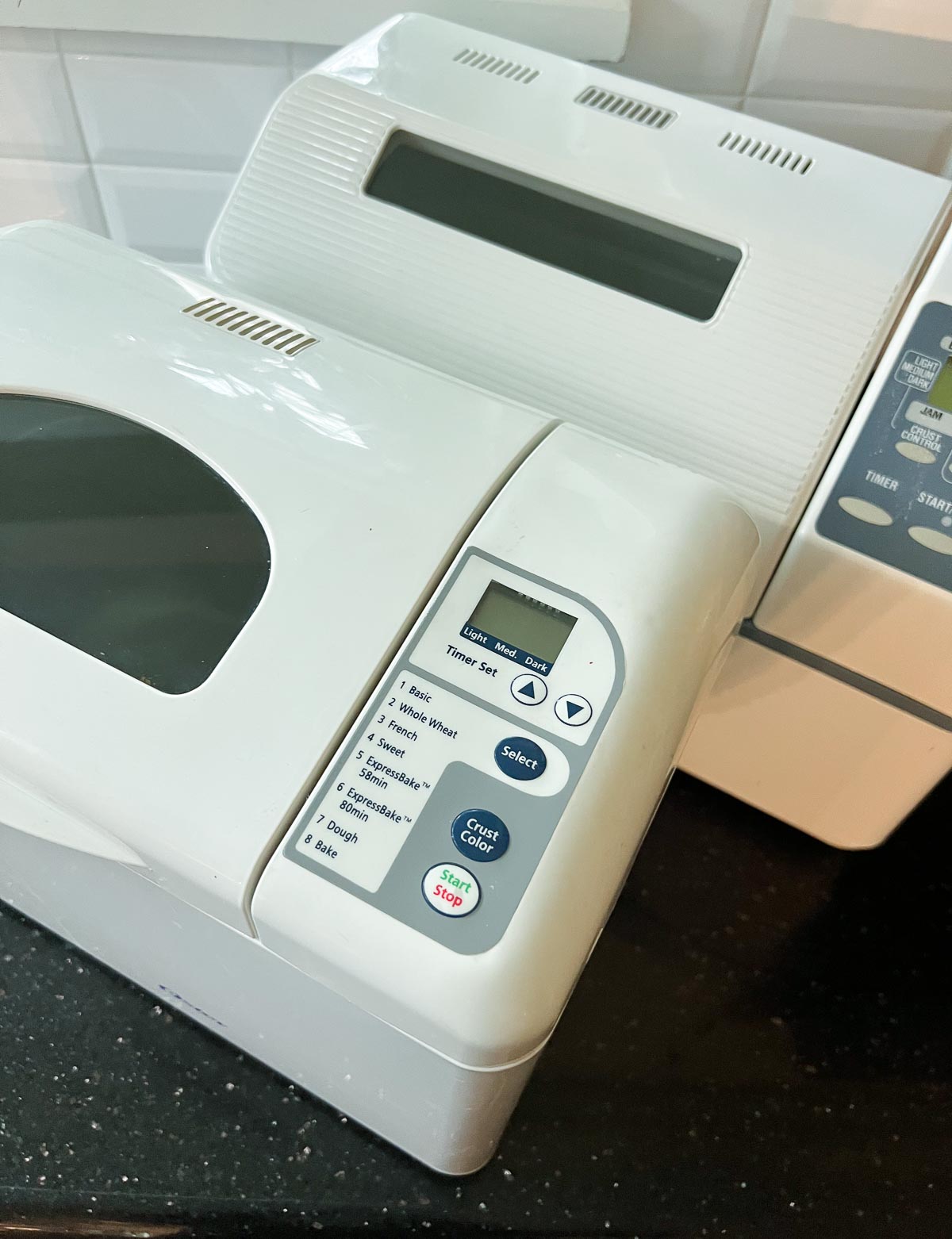 comparing two bread machines side by side.
