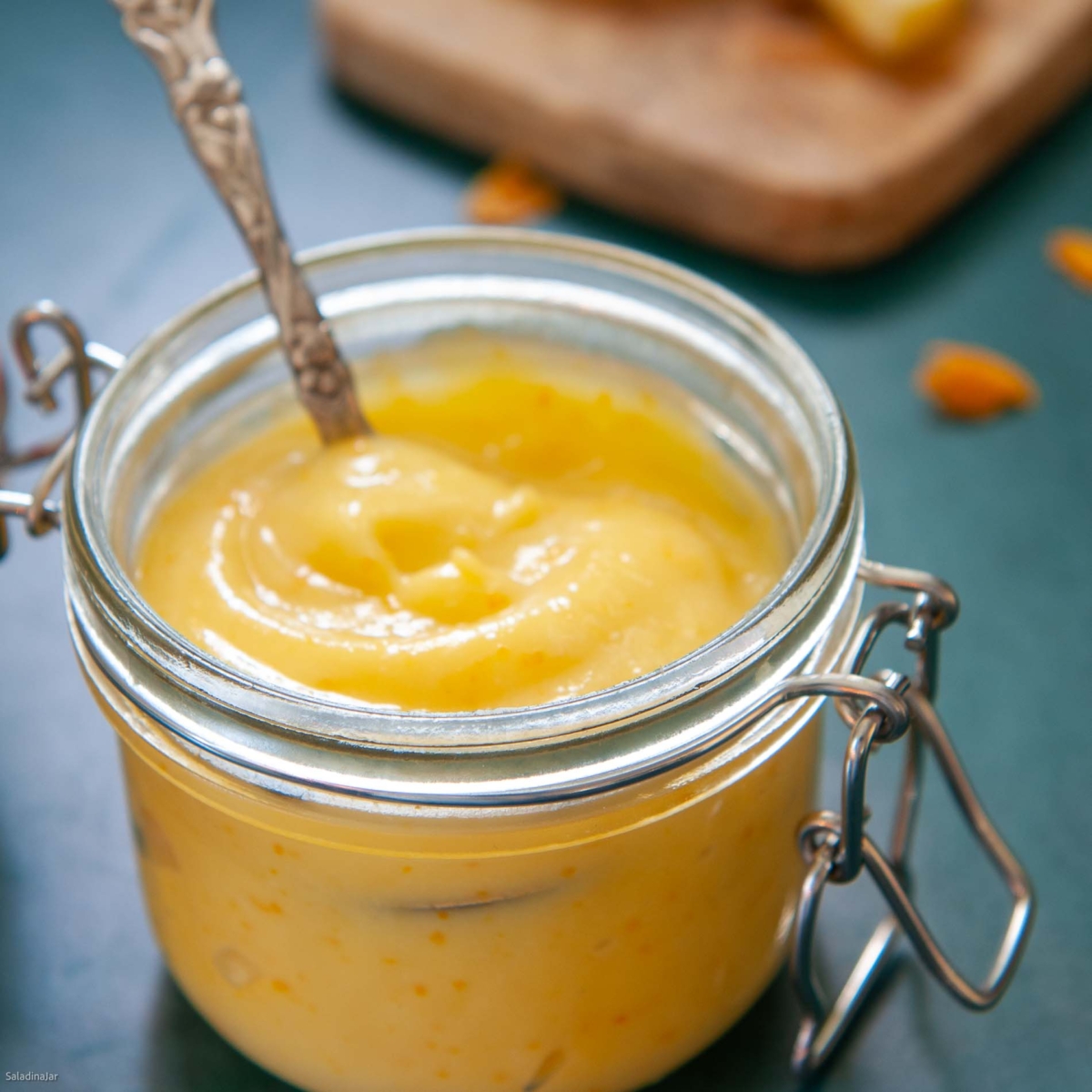 orange curd in a decorative jar