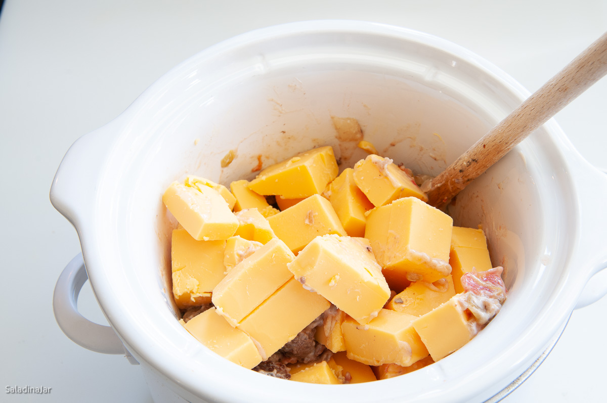 cubed velveeta added to crockpot