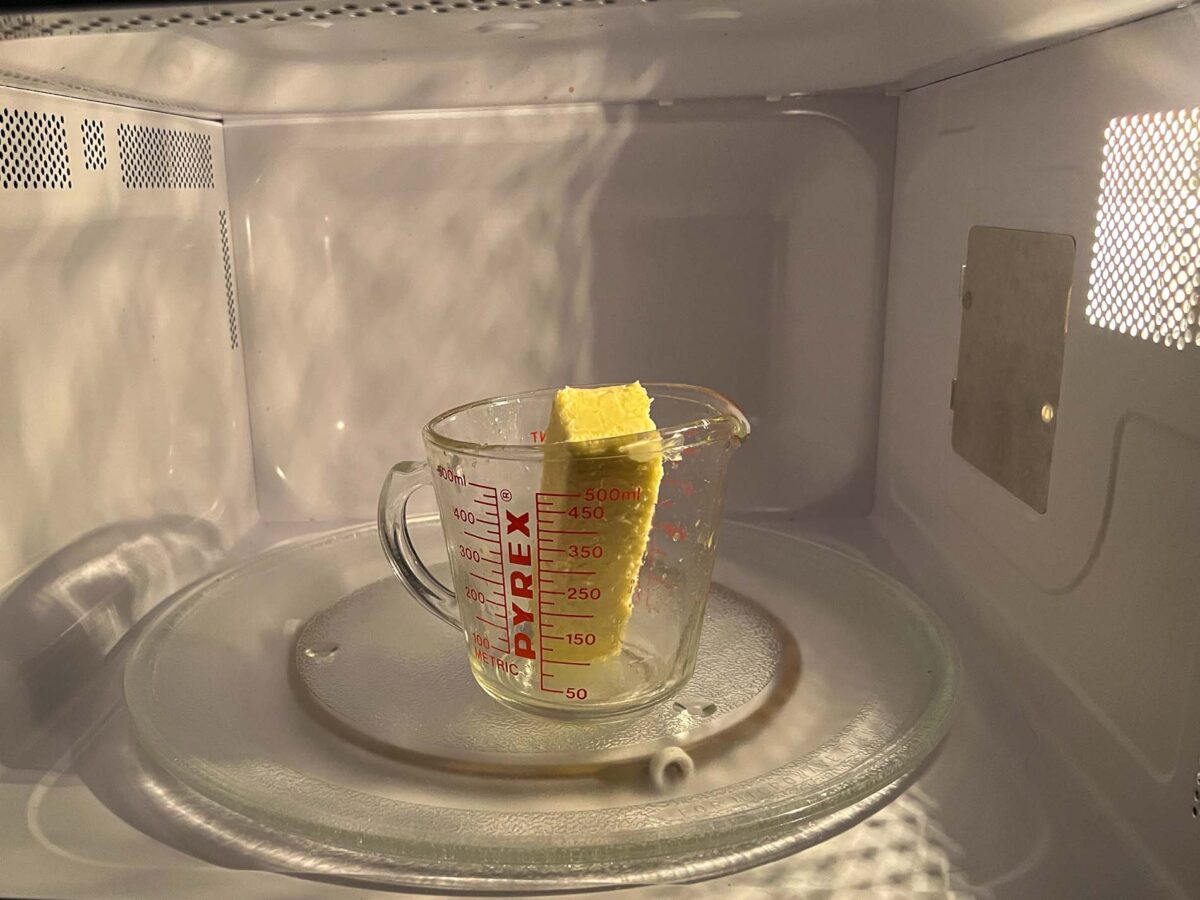 Melting butter in a microwave on HIGH.