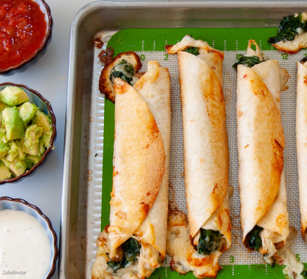 bkaed flautas with chicken and spinach