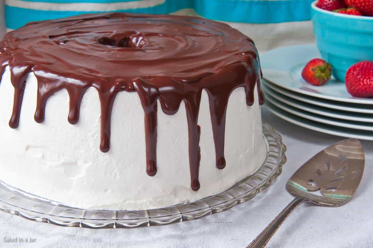 cake ready to be served with strawberries on the side