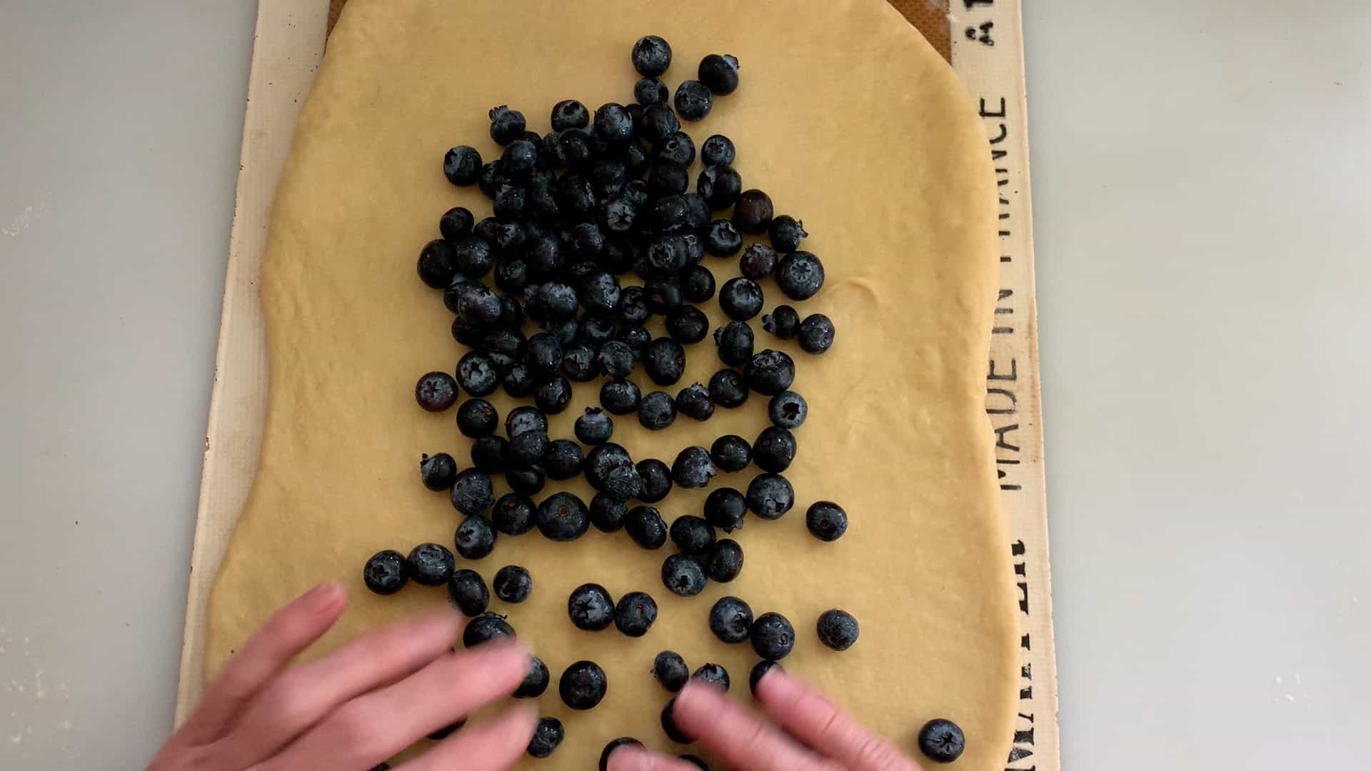 sprinkle blueberries over the dough