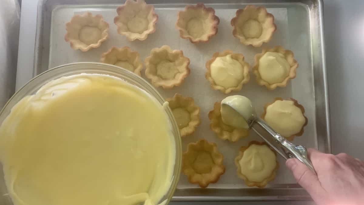 using a spring-loaded dipper to fill baked tartlet shells