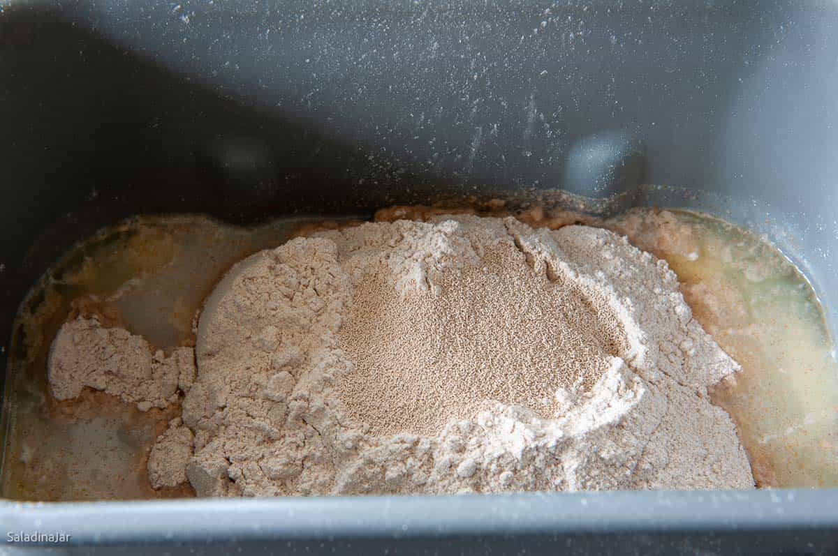 assembling ingredients in the bread machine pan
