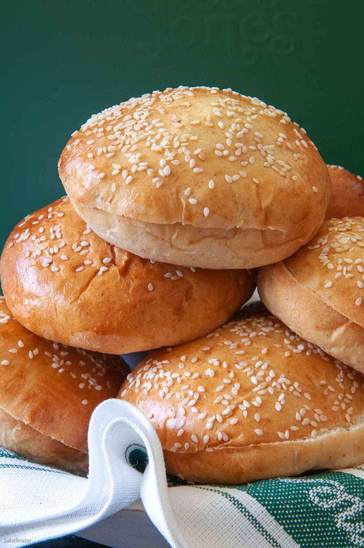 baked buns covered with glaze and sesame seeds.