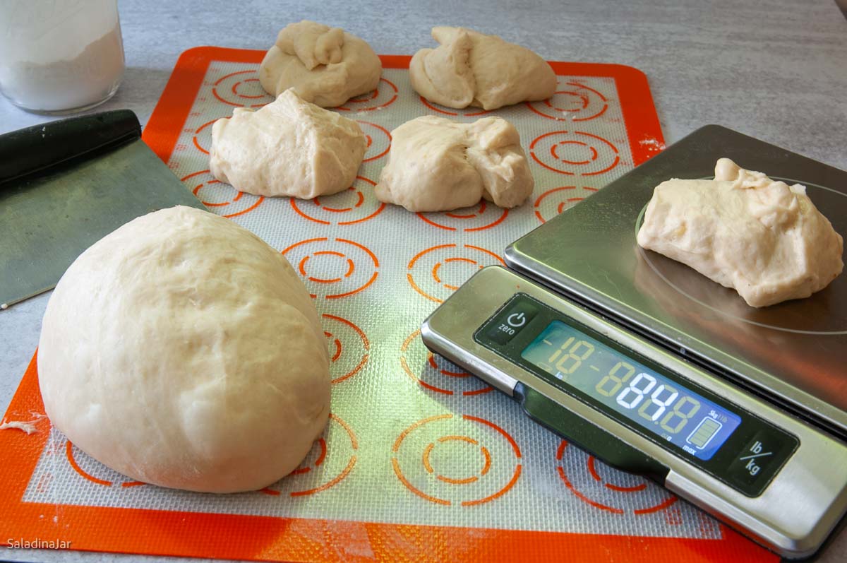 portioning the dough for buns