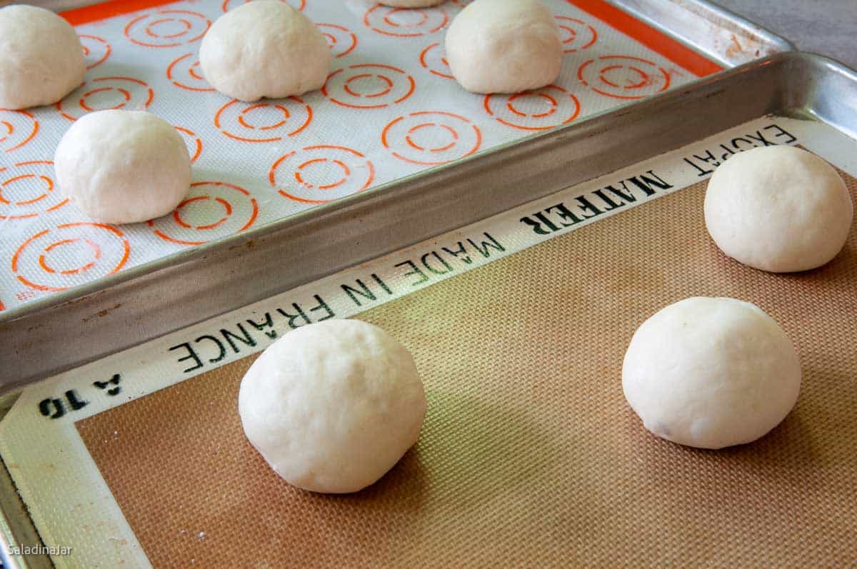 arranging the rolls on a prepared cookie sheet.