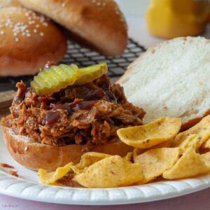 pulled pork sandwich on a potato burger bun made with a bread machine