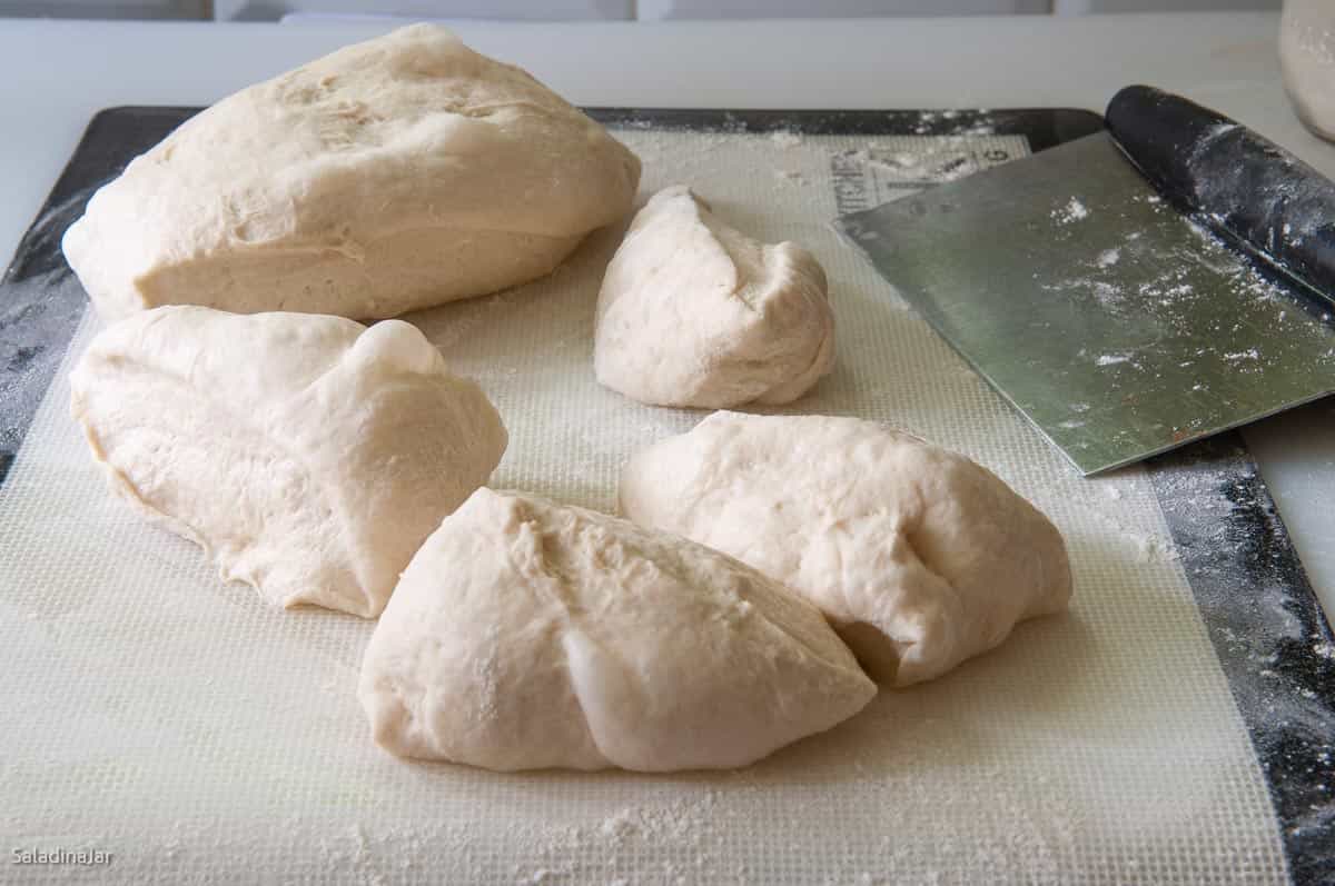 Dividing the dough into eight portions.