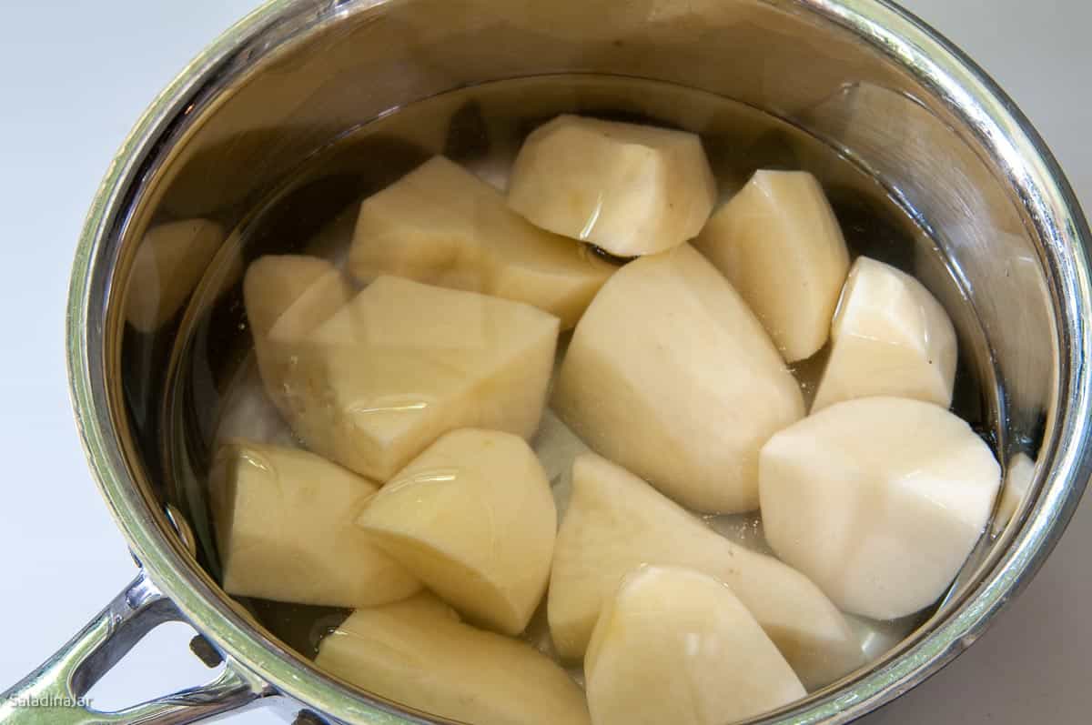 cooking potatoes in water in a saucepan