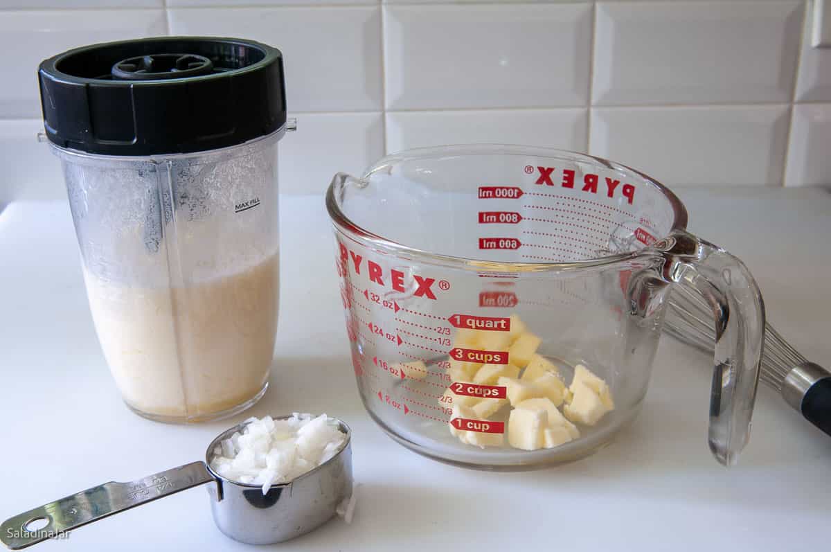 Adding the butter and chopped onion to the dressing ingredients