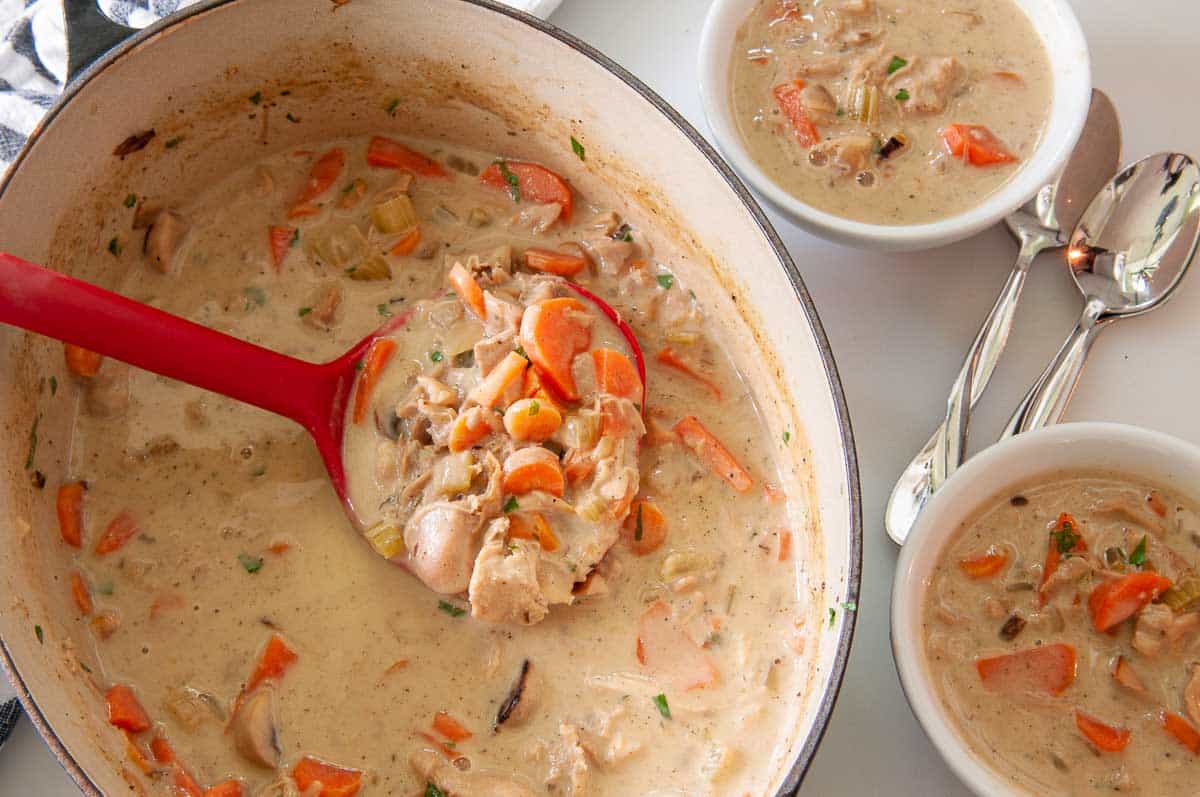 Serving soup into bowls