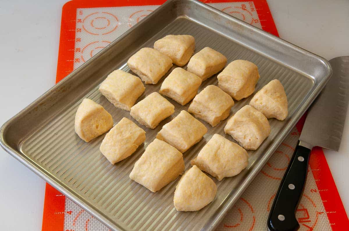 arranging rolls on a cookie sheet