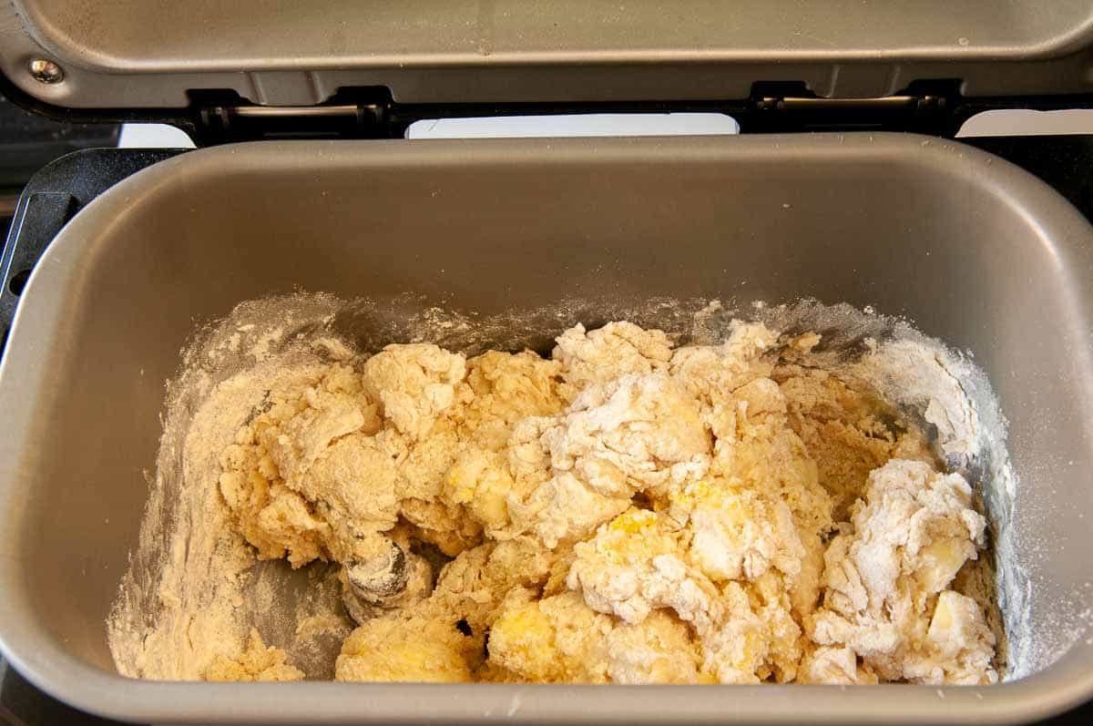 Checking the dough after the first minute to make sure it is gathering into a ball.