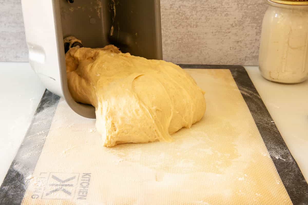 Pulling the bread out of the bread machine pan