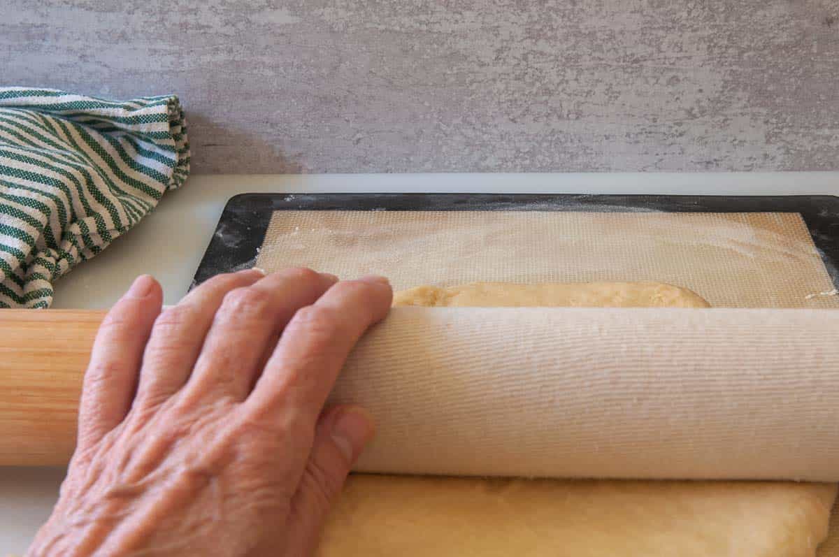 rolling dough into a rectangle.