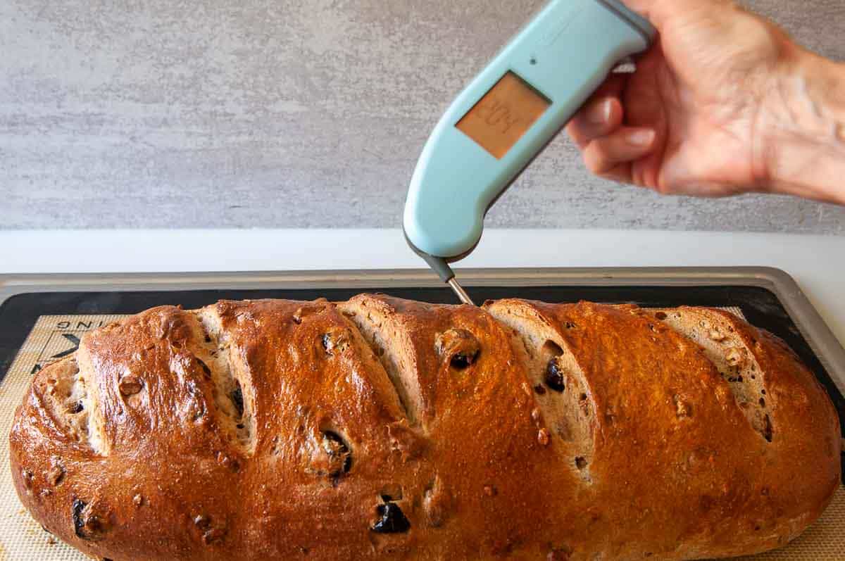 Using a quick-read thermometer to ensure the bread is baked all the way through.