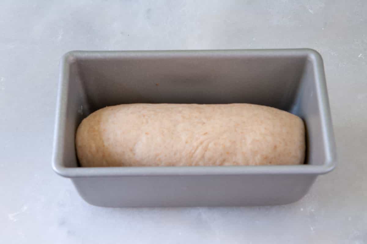 dough is placed with the seam side down into the pan