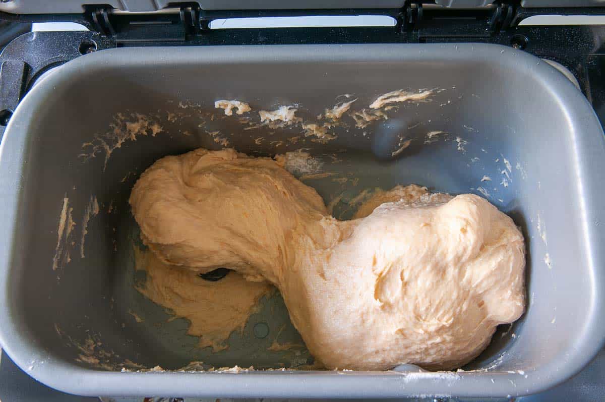 The dough should become smooth and elastic towards the end of the kneading phase.