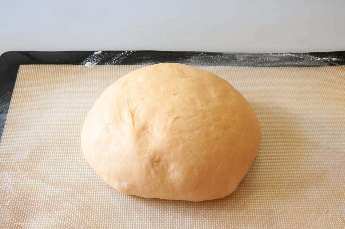 shaping the dough into a large ball.