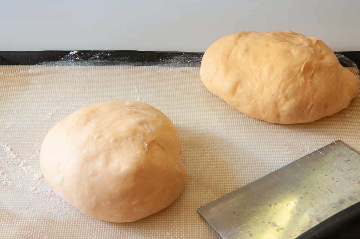 Dividing the dough ball in half.