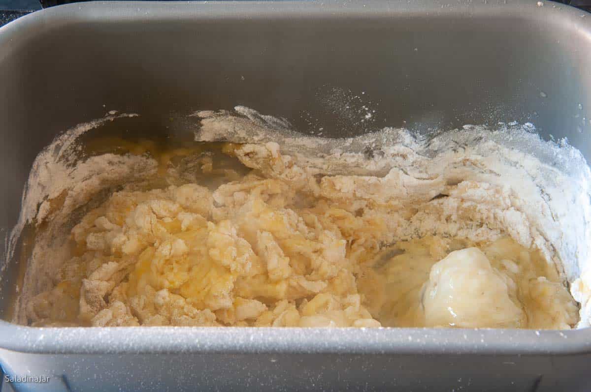 the dough should start to clump together in the first minute of mixing.