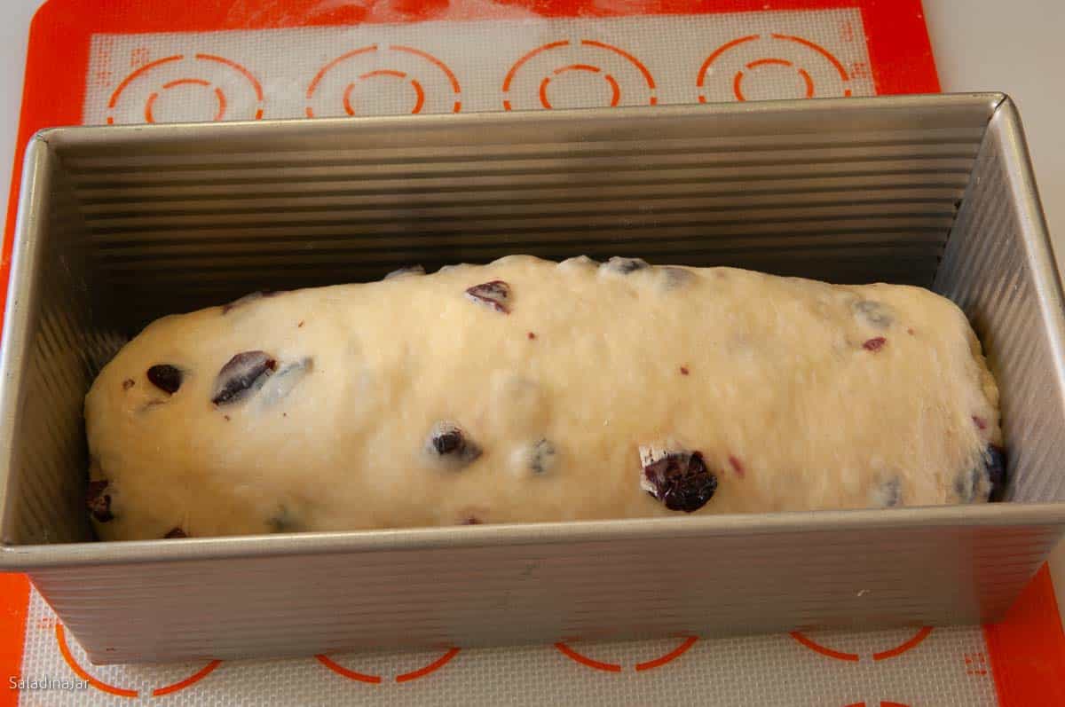 dough placed inside of a loaf pan to rise one more time.