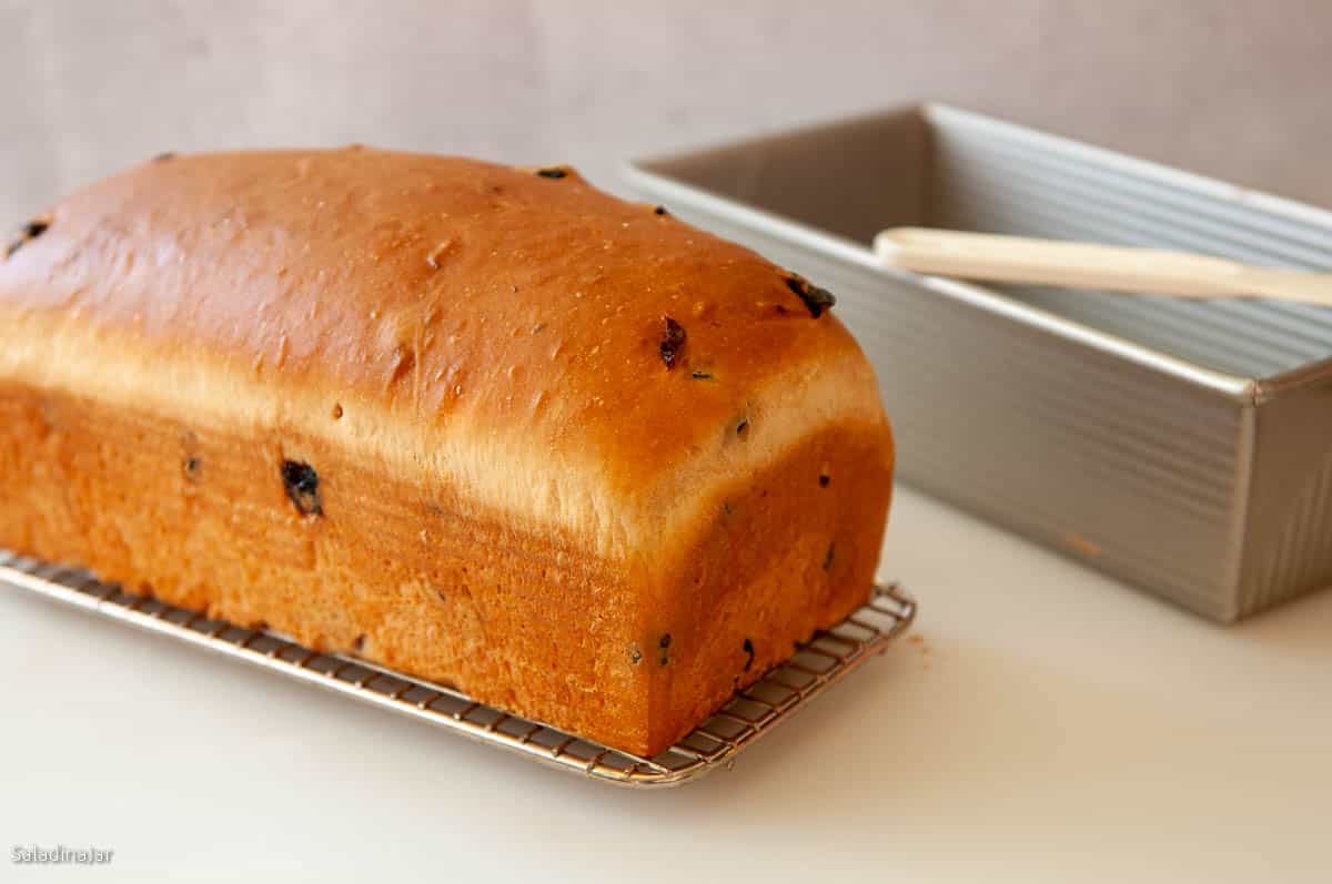 baked loaf cooling on wire rack