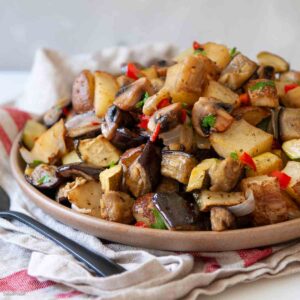 Roasted eggplant and potatoes on a plate for serving