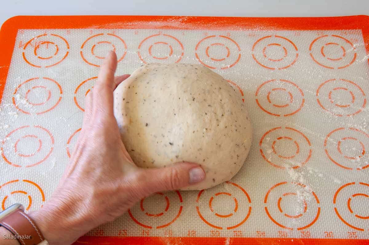 Shaping dough into a ball.