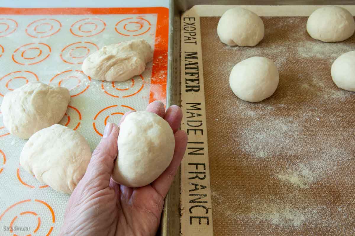 Rolling each portion into a ball.