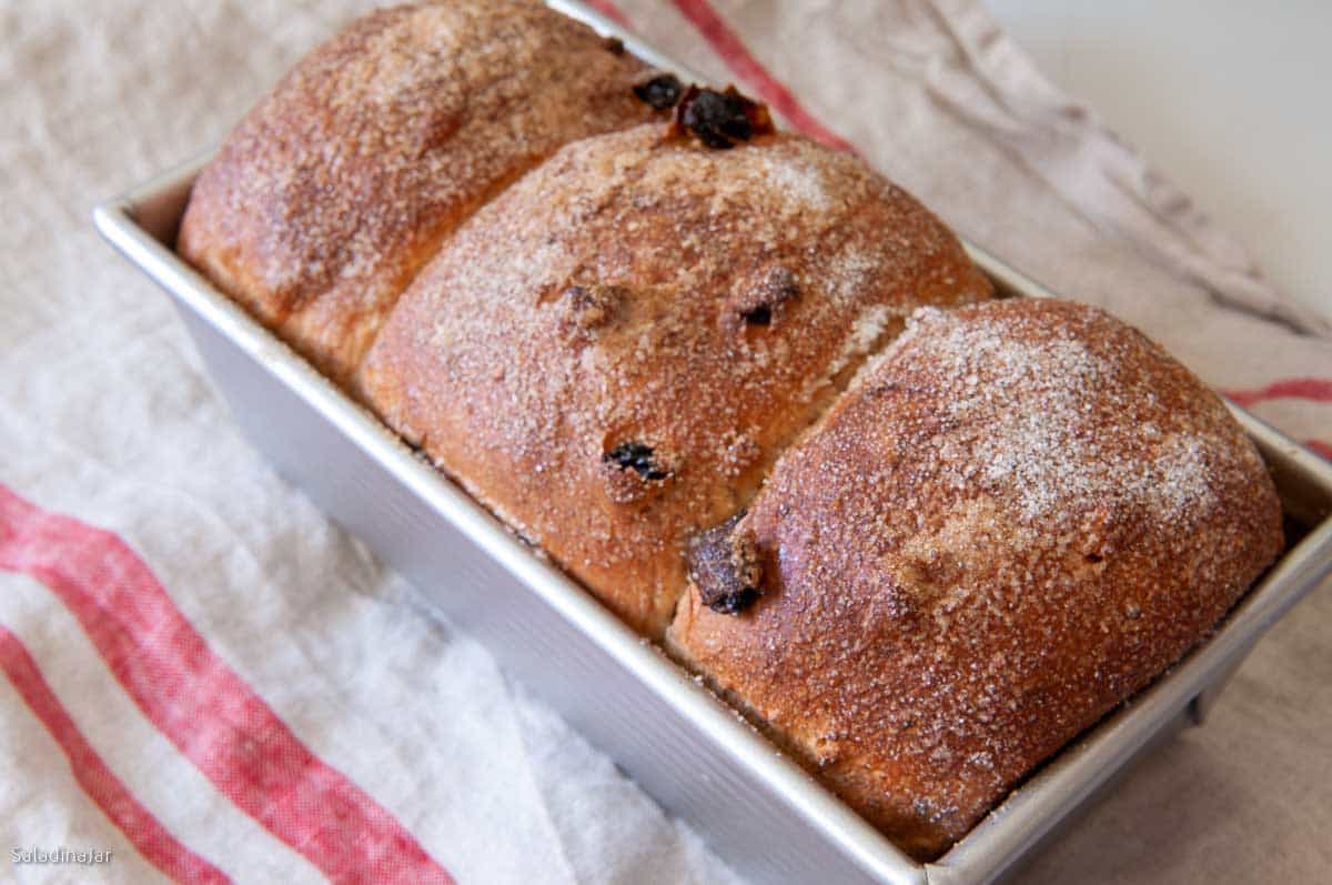 Baked loaf cooling in the pan.