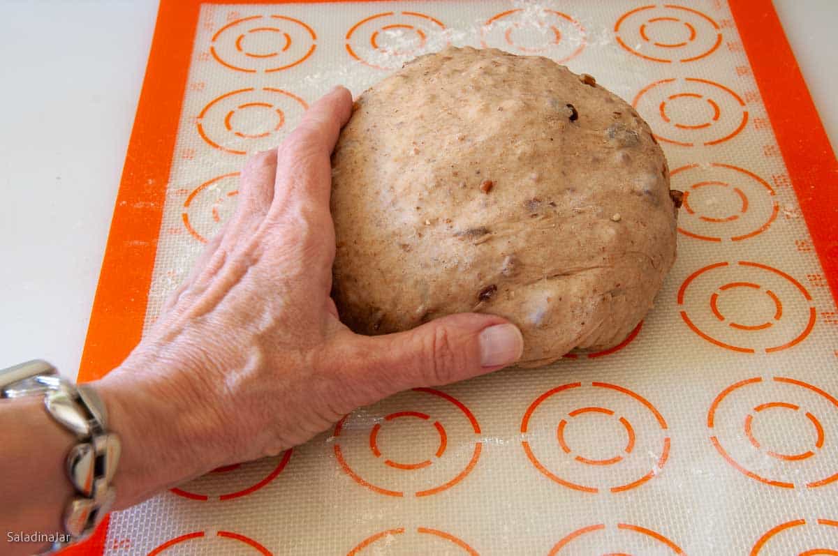 shaping the dough into a ball.